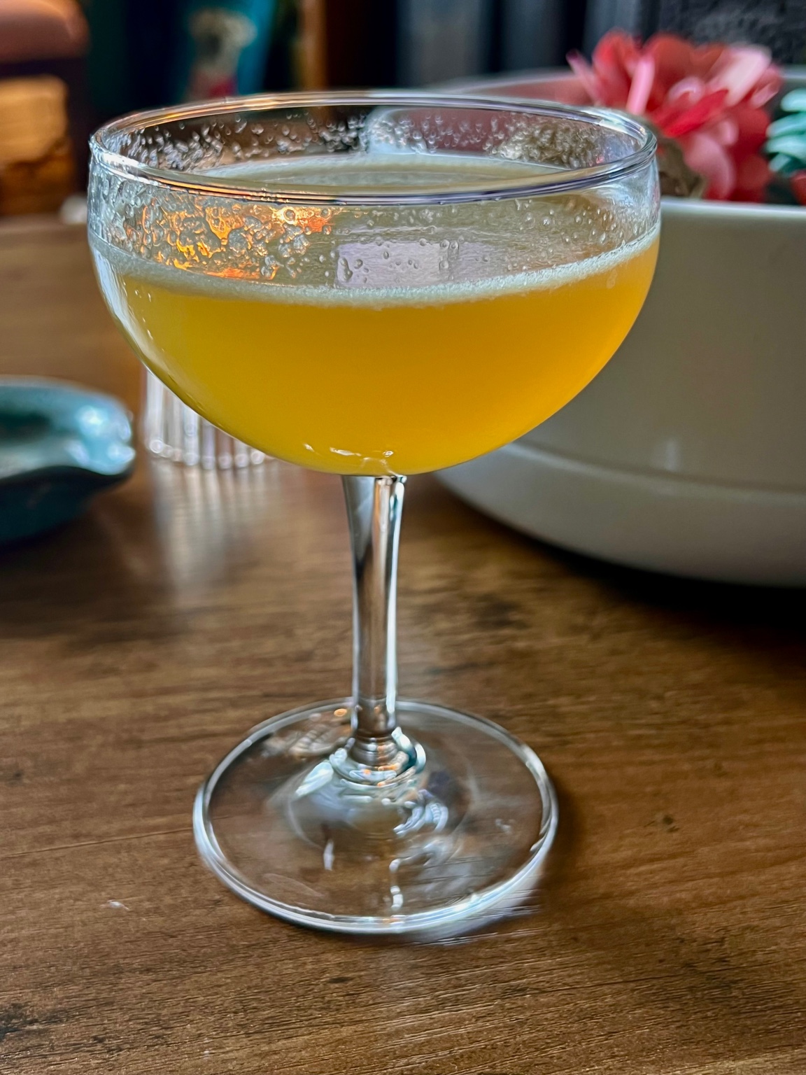 Mocktail with edible flower garnish by Vagabond Libations Co.